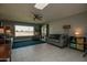 Bright living room with tile floors and golf course view at 18435 N 125Th Ave, Sun City West, AZ 85375