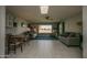 Bright living room with tile floors and golf course view at 18435 N 125Th Ave, Sun City West, AZ 85375