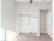 Bedroom with built-in shelving and wood-look floors at 20206 N 32Nd Pl, Phoenix, AZ 85050