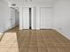 Simple bedroom with double closets and tile flooring at 3007 W Redfield Rd, Phoenix, AZ 85053
