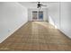 Spacious living room featuring tile floors and sliding door access to backyard at 3007 W Redfield Rd, Phoenix, AZ 85053