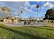 Community pool with lounge chairs and picnic tables at 3007 W Redfield Rd, Phoenix, AZ 85053