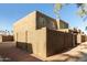 Rear view of tan stucco building, showing a small, walled patio at 4223 S 47Th Pl, Phoenix, AZ 85040