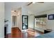 Main bedroom with hardwood floors, large window and mirrored closet at 56 W Windsor Ave, Phoenix, AZ 85003