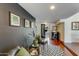 Sitting area features hardwood floors, black accent wall, and leafy plants at 56 W Windsor Ave, Phoenix, AZ 85003