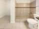 Clean bathroom with a tiled shower/tub combo and toilet at 1013 W Angela Dr, Phoenix, AZ 85023