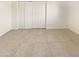 Spacious bedroom with large closet and tile floors at 1013 W Angela Dr, Phoenix, AZ 85023