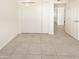 Bedroom with double door closet and tile floors at 1013 W Angela Dr, Phoenix, AZ 85023