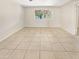 Bedroom with tile floors and window looking out to backyard at 1013 W Angela Dr, Phoenix, AZ 85023