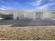 Single story home with rock landscaping and two-car garage at 1013 W Angela Dr, Phoenix, AZ 85023