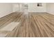 Bright living room featuring hardwood floors and view to the dining area at 1013 W Angela Dr, Phoenix, AZ 85023