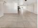 Open living area with tile floors and view into kitchen at 1013 W Angela Dr, Phoenix, AZ 85023