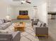 Bright living room with comfy seating and a large TV at 1013 W Angela Dr, Phoenix, AZ 85023