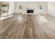 Living room with fireplace and wood-look floors at 1013 W Angela Dr, Phoenix, AZ 85023