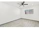 Well-lit bedroom featuring wood-look floors and a ceiling fan at 102 W Maryland Ave # F1, Phoenix, AZ 85013