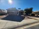 Tan colored stucco one story home with attached garage and driveway at 1073 E Buena Vista Dr, Chandler, AZ 85249