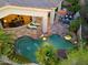 Overhead view of luxurious pool, spa and patio area at 10891 E Via Dona Rd, Scottsdale, AZ 85262