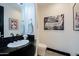 Stylish powder room with black vanity and modern fixtures at 10891 E Via Dona Rd, Scottsdale, AZ 85262