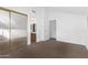 Well-lit bedroom with mirrored closet and access to bathroom at 12445 N 21St Ave # 28, Phoenix, AZ 85029