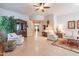 Spacious living room with two armchairs and a view into dining area at 12889 N 145Th Way, Scottsdale, AZ 85259