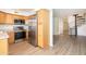Modern kitchen with stainless steel appliances and wood cabinets at 1425 E Desert Cove Ave # 32, Phoenix, AZ 85020