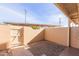 Small, private patio area with a gravel yard and gated access at 1425 E Desert Cove Ave # 32, Phoenix, AZ 85020