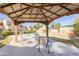 Relaxing pool area with covered seating and patio furniture at 1425 E Desert Cove Ave # 32, Phoenix, AZ 85020