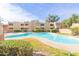 Community swimming pool with surrounding landscaping at 1425 E Desert Cove Ave # 32, Phoenix, AZ 85020