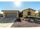 Single-story house with gray garage door and a landscaped front yard at 1617 E Judi St, Casa Grande, AZ 85122