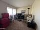 Home office with carpet, window, and multiple chairs at 1628 E Kent Ave, Chandler, AZ 85225