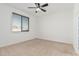 Spacious bedroom with ceiling fan and neutral wall color at 1650 E Kingman Pl, Casa Grande, AZ 85122