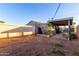 Large backyard with covered patio and block wall at 1702 W Indian School Rd, Phoenix, AZ 85015