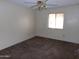 Simple carpeted bedroom with a ceiling fan and window at 1942 S Emerson -- # 222, Mesa, AZ 85210