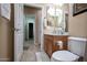 Clean bathroom with single sink vanity and shower/tub combo at 27292 W Ross Ave, Buckeye, AZ 85396