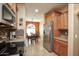 Kitchen features stainless steel appliances and granite countertops at 27292 W Ross Ave, Buckeye, AZ 85396