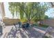 Backyard with patio, fire pit and large tree at 2832 E Laurel St, Mesa, AZ 85213
