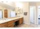 Bathroom with double sinks and a view into another room at 2832 E Laurel St, Mesa, AZ 85213