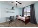 Light blue bedroom featuring a twin bed and workspace at 2832 E Laurel St, Mesa, AZ 85213