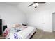 Spacious bedroom with a king-size bed and ceiling fan at 2832 E Laurel St, Mesa, AZ 85213