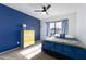 Bedroom with a full bed and blue accent wall at 2832 E Laurel St, Mesa, AZ 85213