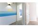 Bright hallway with blue and teal accent wall at 2832 E Laurel St, Mesa, AZ 85213