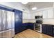 Modern kitchen featuring stainless steel appliances and blue cabinetry at 2832 E Laurel St, Mesa, AZ 85213