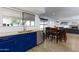 Kitchen with blue cabinets, wood floors, and a breakfast bar at 2832 E Laurel St, Mesa, AZ 85213
