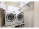 Laundry room with washer, dryer and shelving at 2832 E Laurel St, Mesa, AZ 85213