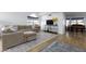 Spacious living room with L-shaped sofa and wood floors at 2832 E Laurel St, Mesa, AZ 85213