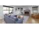 Living room featuring a brick fireplace and large windows at 2832 E Laurel St, Mesa, AZ 85213