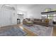Bright living room with L-shaped sofa and wood floors at 2832 E Laurel St, Mesa, AZ 85213