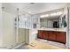 Elegant bathroom featuring double sinks and a soaking tub at 30276 W Crittenden Ln, Buckeye, AZ 85396