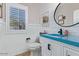 Stylish bathroom with a modern concrete sink and white vanity at 30276 W Crittenden Ln, Buckeye, AZ 85396