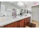 Clean bathroom with double vanity and wood cabinets at 30276 W Crittenden Ln, Buckeye, AZ 85396